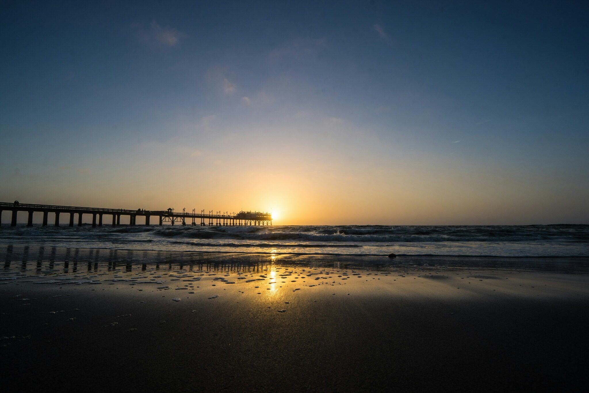 Swakopmund jetty and Atlantic shoreline at sunset